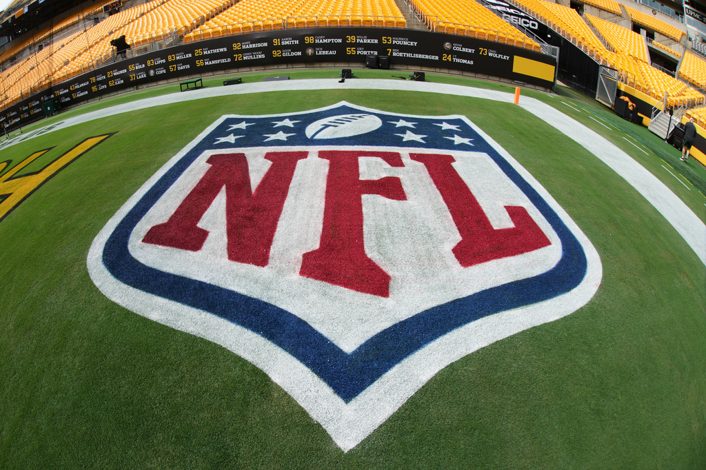 The NFL logo is shown the field before the start of a preseason NFL football game between the Green Bay Packers and the Pittsburgh Steelers in Pittsburgh, Thursday, Aug. 13, 2026. (AP Photo/Gene J. Puskar)