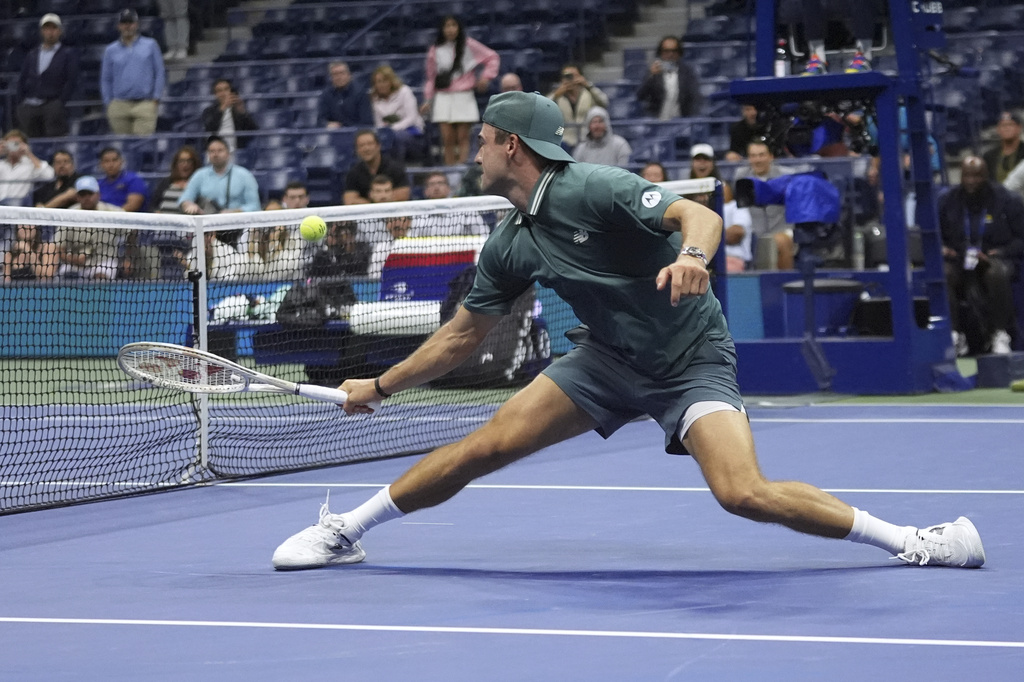 Tommy Paul, of the United States, returns a shot to Nuno Borges, of Portugal, during the second round of the U.S. Open tennis championships, Thursday, Aug. 28, 2025, in New York. (AP Photo/Frank Franklin II)