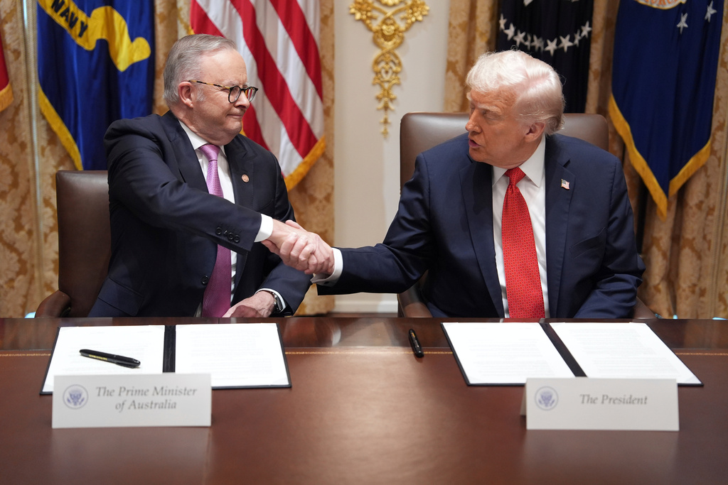 President Donald Trump, right, shakes the hand of Australian Prime Minister Anthony Albanese during a meeting in the Cabinet Room of the White House, Monday, October 20, 2025, in Washington. (AP Photo/Evan Vucci)