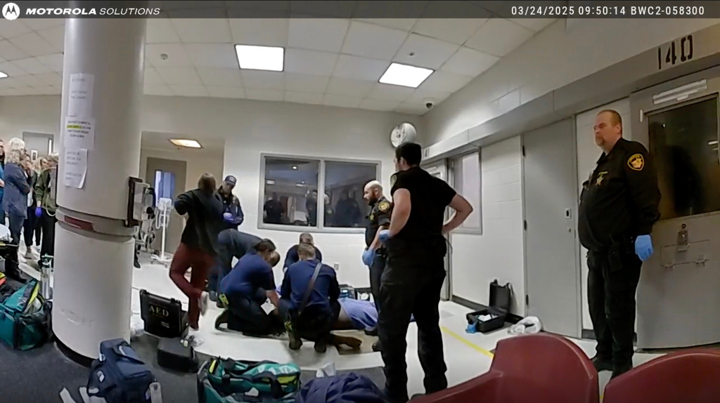 This image taken from video released by the Montgomery County Sheriff's Office shows law enforcement giving aid to Christian Black inside Montgomery County Jail on March 24, 2025 in Dayton, Ohio. (Montgomery County Sheriff's Office via AP)