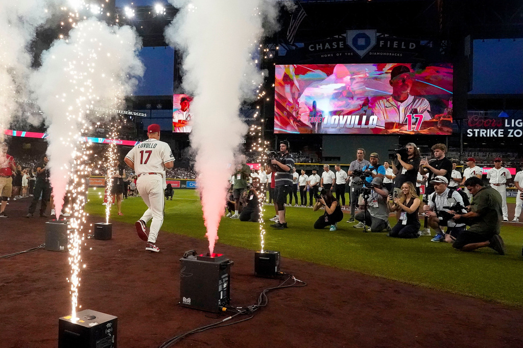 Arizona Diamondbacks manager Torey Lovullo (17) is introduced before their opening-day baseball game against the Detroit Tigers Monday, March 30, 2026, in Phoenix. (AP Photo/Darryl Webb)