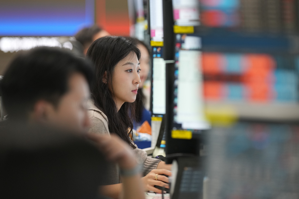 A dealer watches computer monitors at a dealing room of Hana Bank in Seoul, South Korea, Friday, May 8, 2026. (AP Photo/Lee Jin-man)