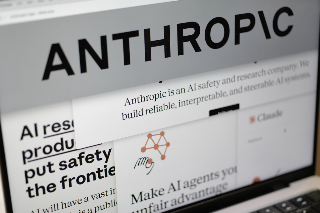 FILE - Pages from the Anthropic website and the company's logo are displayed on a computer screen in New York, Feb. 26, 2026. (AP Photo/Patrick Sison, File)