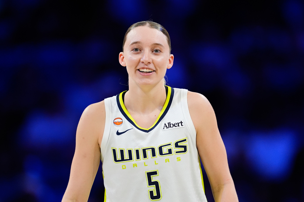 Dallas Wings guard Paige Bueckers talks with teammates in the second half of a WNBA basketball game against the Connecticut Sun in Arlington, Texas, Sunday, Aug. 2, 2026. (AP Photo/Tony Gutierrez)