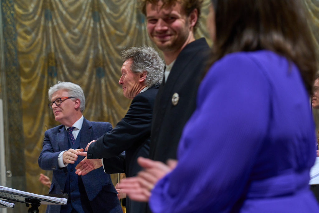 From left, composer James MacMillan, conductor Harry Christophers, tenor Matthew McKinney, and soprano Elizabeth Watts acknowledge the audience's applause at the end of MacMillan's oratorio Angels Unawares performed in the Sistine Chapel at the Vatican, Sunday, March 22, 2026. (AP Photo/Domenico Stinellis)