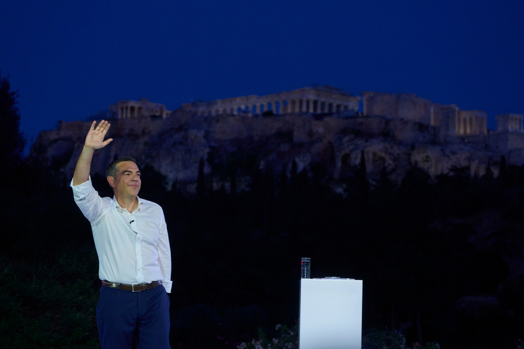 Former left-wing Prime Minister Alexis Tsipras waves to supporters in front of ancient Acropolis at an event to launch a new political party ahead of elections next year, in Athens, on Tuesday, May 26, 2026. (AP Photo/Petros Giannakouris)
