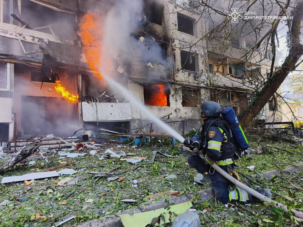 In this photo provided by the Ukrainian Emergency Service, firefighters put out a fire in a residential building following a Russian air attack in Pavlohrad, Dnipropetrovsk region, Ukraine, Monday, July 20, 2026. (Ukrainian Emergency Service via AP)