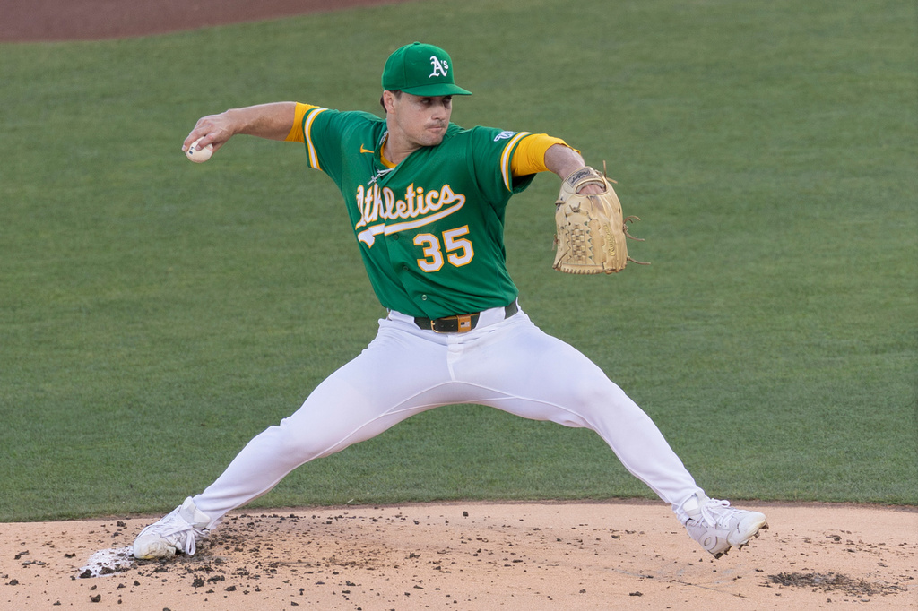 Athletics pitcher J.T. Ginn throws to the Los Angeles Dodgers during the first inning of a baseball game Wednesday, July 1, 2026, in West Sacramento, Calif. (AP Photo/Sara Nevis)
