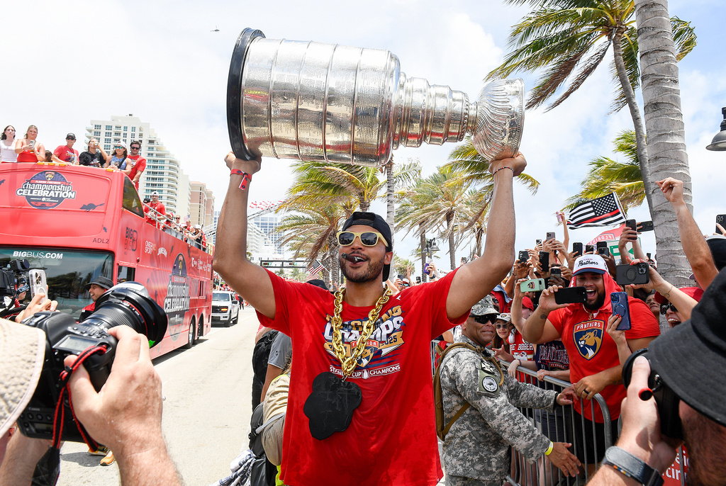 FILE - Florida Panthers Seth Jones carries the Stanley Cup during the NHL hockey team's Stanley Cup championship celebration, Sunday, June, 22, 2025, in Fort Lauderdale, Fla. (AP Photo/Michael Laughlin, File)