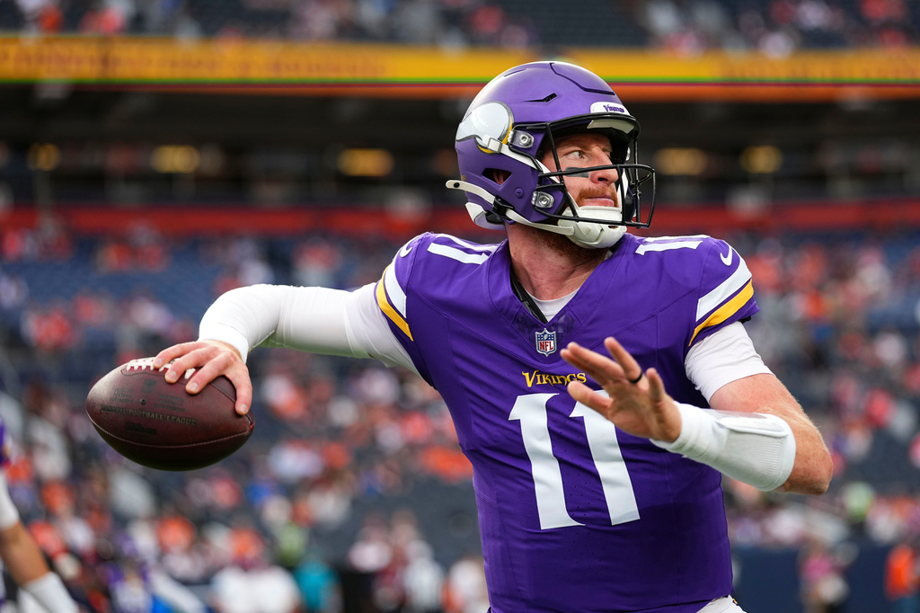 Minnesota Vikings quarterback Carson Wentz warms up before a preseason NFL football game against the Denver Broncos, Friday, Aug. 28, 2026, in Denver. (AP Photo/Jack Dempsey)