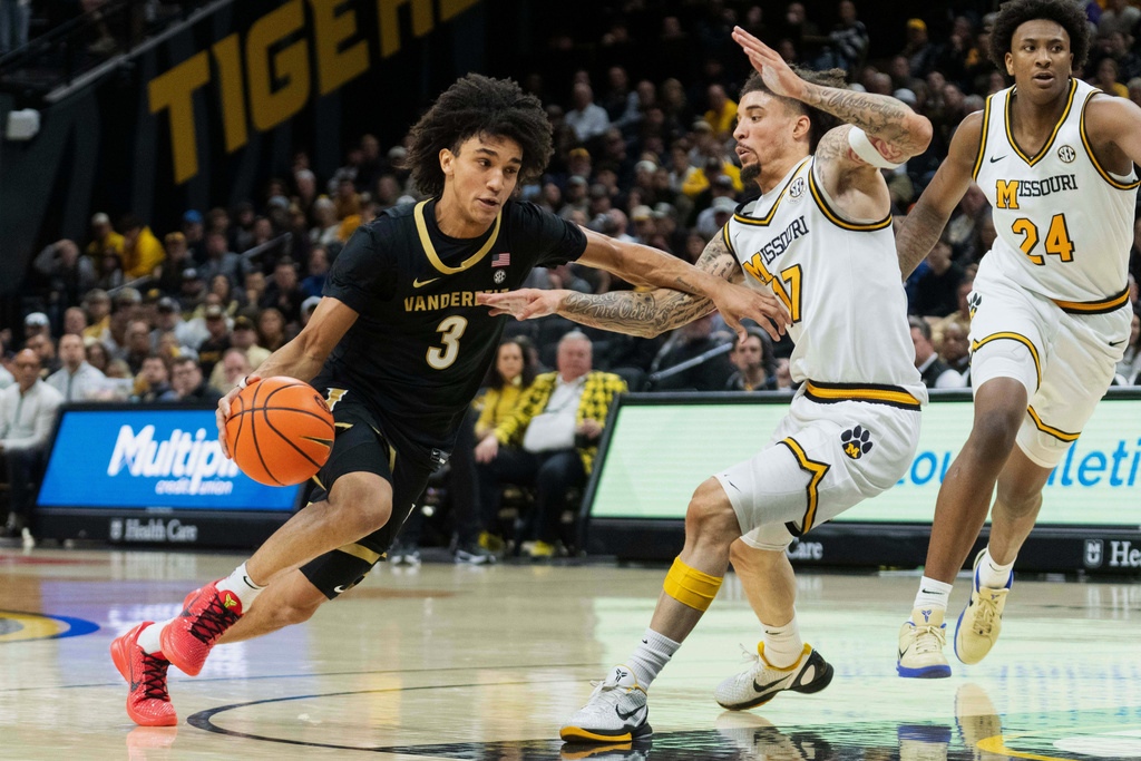 Vanderbilt's Tyler Tanner (3) drives past Missouri's Jayden Stone (17) during the first half of an NCAA college basketball game Wednesday, Feb. 18, 2026, in Columbia, Mo. (AP Photo/L.G. Patterson)