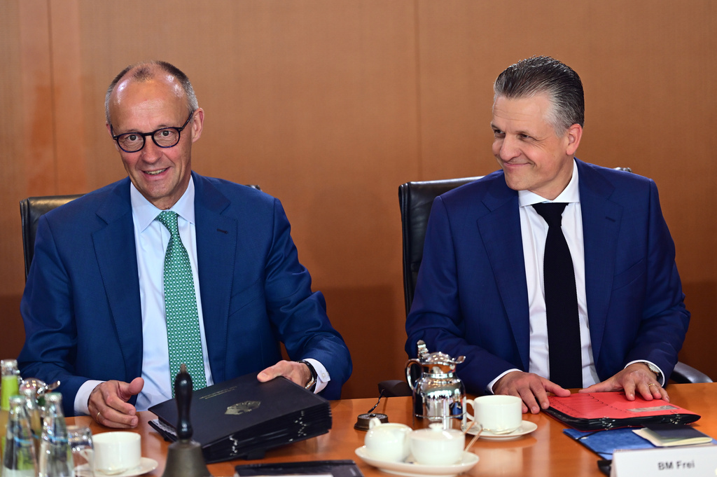 German Chancellor Friedrich Merz, left, and Thorsten Frei, Head of the Federal Chancellery and Federal Minister for Special Tasks attend the cabinet meeting at the chancellery in Berlin, Germany, Wednesday, July 22, 2026. (Sebastian Gollnow/dpa via AP)