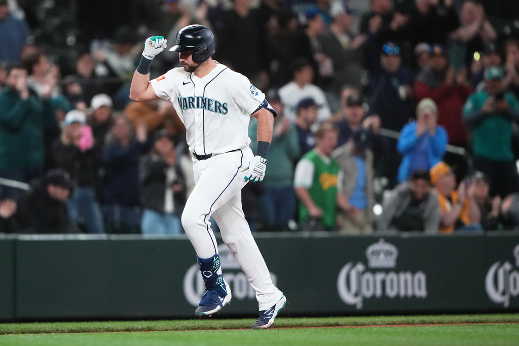 Seattle Mariners designated hitter Cal Raleigh jogs home after hitting a solo home run against the Athletics during the fifth inningof a baseball game, Tuesday, April 21, 2026, in Seattle. (AP Photo/Lindsey Wasson)
