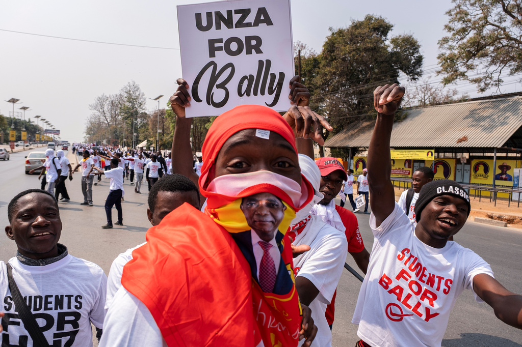 Supporters of Zambian incumbent President and United Party for National Development (UPND) presidential candidate Hakainde Hichilema campaign on the street in Lusaka, Zambia, Monday, Aug. 10, 2026. (AP Photo/Anita Reed)