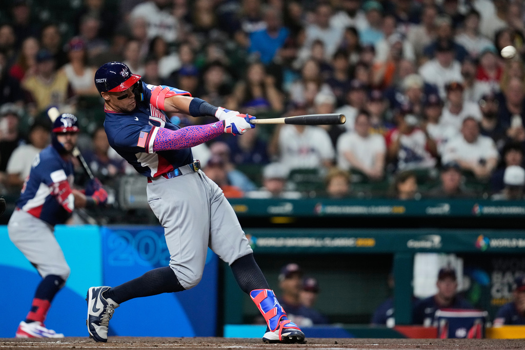 United States' Aaron Judge (99) hits a two-run home run during the first inning of a World Baseball Classic game against Brazil, Friday, March 6, 2026, in Houston. (AP Photo/Ashley Landis)