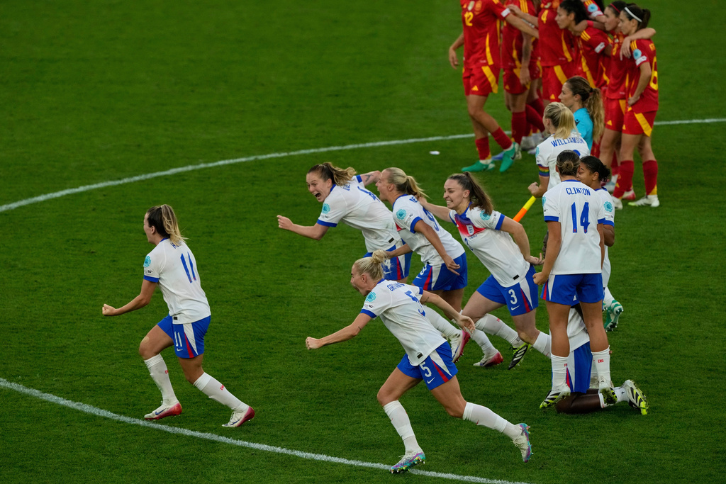 FILE - England players celebrate after winning the Women's Euro 2025 final soccer match between England and Spain at St. Jakob-Park in Basel, Switzerland, Sunday, July 27, 2025. (AP Photo/Michael Probst, File)