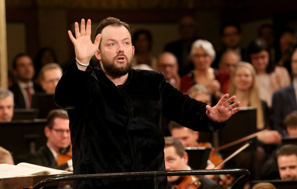 FILE 0 Latvian conductor Andris Nelsons conducts the Vienna Philharmonic Orchestra during a rehearsal for the traditional New Year's concert at the golden hall of Vienna's Musikverein, in Vienna, Austria, Monday, Dec. 30, 2019. (AP Photo/Ronald Zak, File)