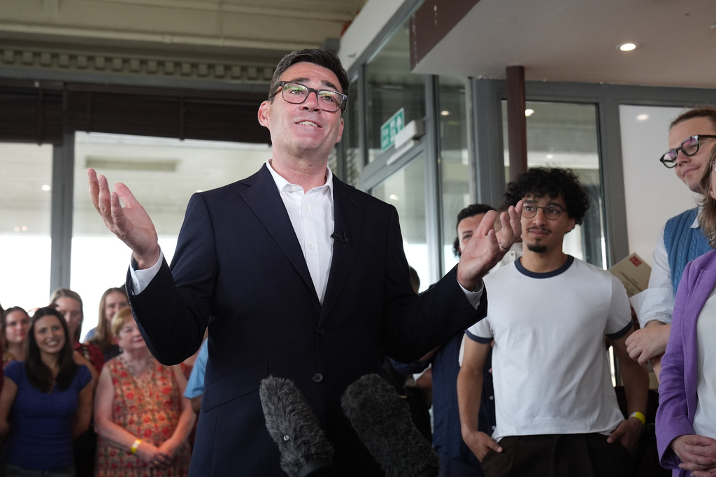 Newly confirmed Labour Party leader Andy Burnham speaks with local stakeholders and party supporters during a visit to Gravesend Town Pier, Gravesend , England, Friday July 17, 2026. (Gareth Fuller/PA via AP)