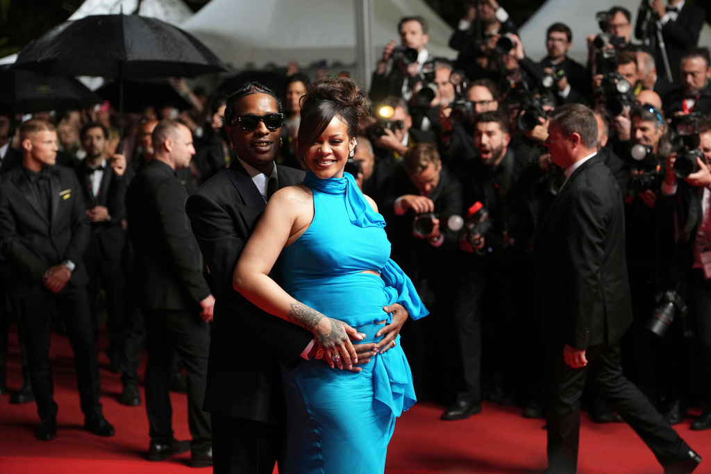 FILE - A$AP Rocky, left, and Rihanna pose for photographers upon departure from the premiere of the film 'Highest 2 Lowest' at the 78th international film festival, Cannes, southern France, Monday, May 19, 2025. (Photo by Lewis Joly/Invision/AP, File)