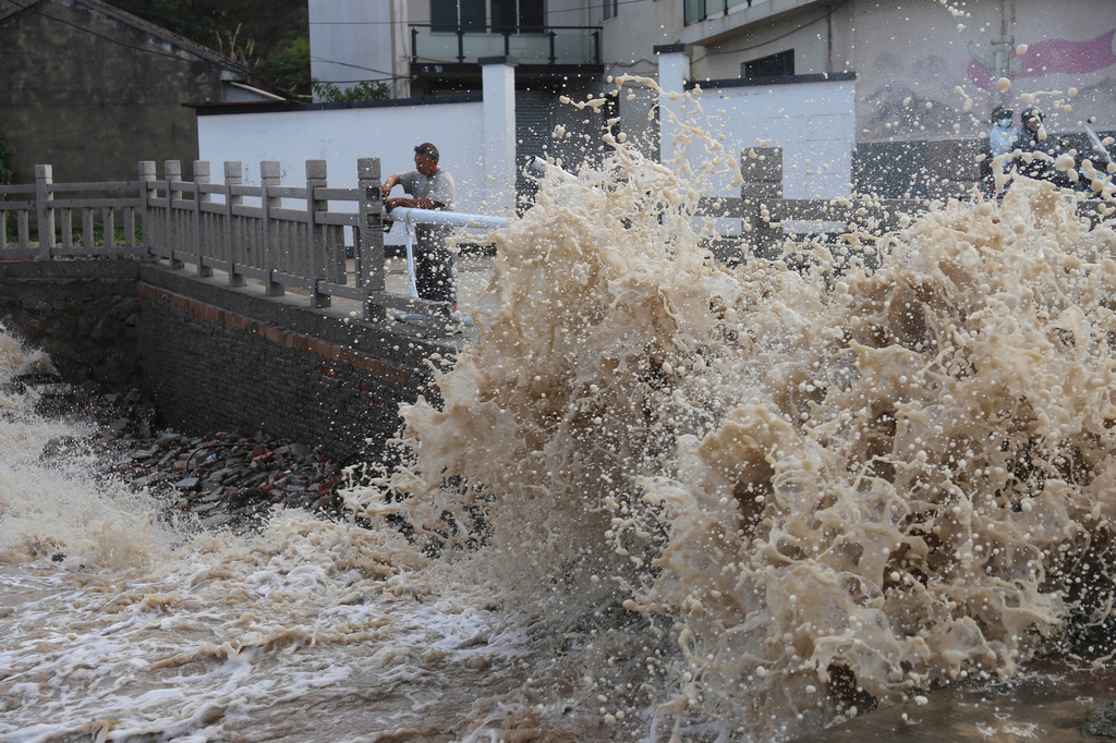 Huge waves crash on the coastline ahead of Typhoon Bavi in Wenling in eastern China's Zhejiang province, Friday, July 10, 2026. (Chinatopix Via AP) CHINA OUT
