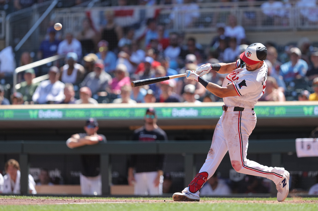 Minnesota Twins' Trevor Larnach hits a solo home run during the eighth inning of a baseball game against the Los Angeles Angels, Sunday, July 12, 2026, in Minneapolis. (AP Photo/Bailey Hillesheim)