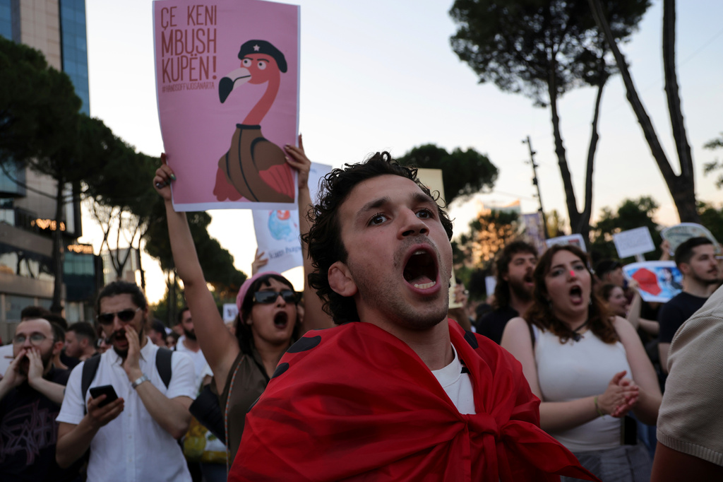 Protesters take part in a rally in Tirana, Albania, Tuesday, June 9, 2026, against the construction of a massive coastal development project linked to Jared Kushner and Ivanka Trump at Narta lagoon area, western Albania. (AP Photo/Hameraldi Agolli)