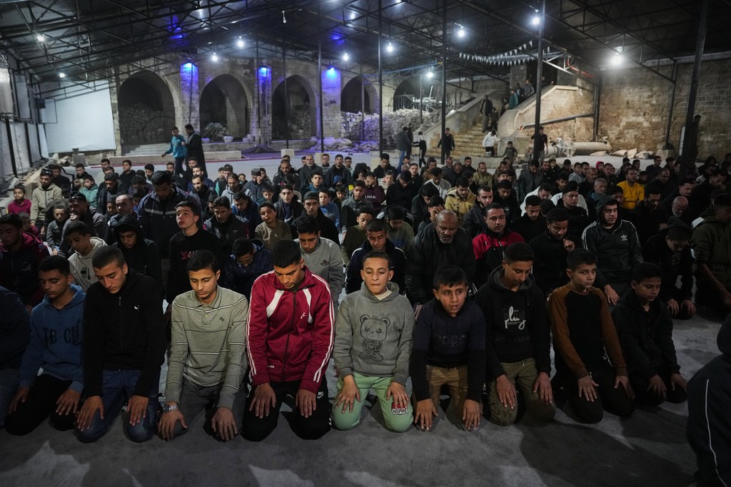 Muslim worshippers perform evening Tarawih prayer on the first night of the holy fasting month of Ramadan at the Great Omari Mosque, which was damaged during the Israel–Hamas war, in Gaza City, Tuesday, Feb. 17, 2026. (AP Photo/Abdel Kareem Hana)