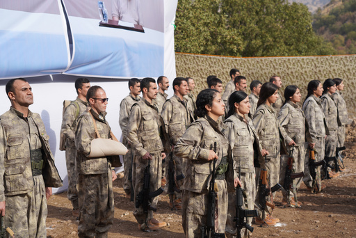 Kurdistan Workers' Party (PKK) fighters, who reportedly withdrew from Turkey with their weapons, stand to attention during a ceremony in the Qandil area of northern, Iraq, Sunday, Oct 26, 2025. (AP Photo/Rashid Yahya) Kurdistan Workers' Party (PKK) fighters, who reportedly withdrew from Turkey with their weapons, stand to attention during a ceremony in the Qandil area of northern, Iraq, Sunday, Oct 26, 2025. (AP Photo/Rashid Yahya)