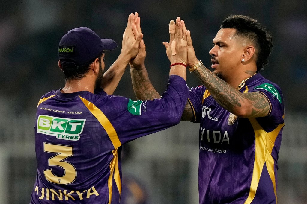 Kolkata Knight Riders' Sunil Narine, right, celebrates with captain Ajinkya Rahane the wicket of Mumbai Indians' captain Hardik Pandya during the Indian Premier League cricket match between Kolkata Knight Riders and Mumbai Indians, in Kolkata , India, Wednesday, May 20, 2026. (AP Photo/Bikas Das)