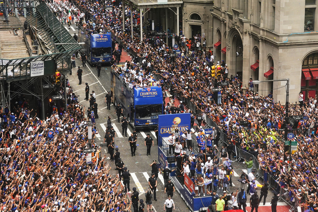 Crowds fill the sidewalks during the NBA Champion New York Knicks ticker-tape parade on Broadway, in New York's "Canyon of Heroes," Thursday, June 18, 2026. (AP Photo/Richard Drew)