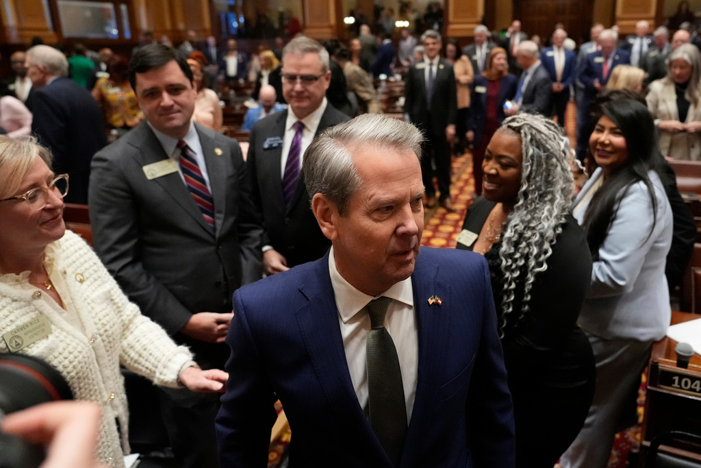 Lawmakers greet Gov. Brian Kemp ahead of his State of the State speech, Thursday, Jan. 15, 2026, in Atlanta. (AP Photo/Brynn Anderson)