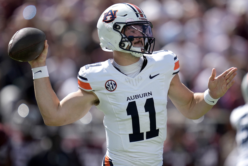 Auburn quarterback Jackson Arnold (11) passes the ball against Texas A&M during the first quarter of an NCAA college football game Saturday, Sept. 27, 2025, in College Station, Texas. (AP Photo/Sam Craft)
