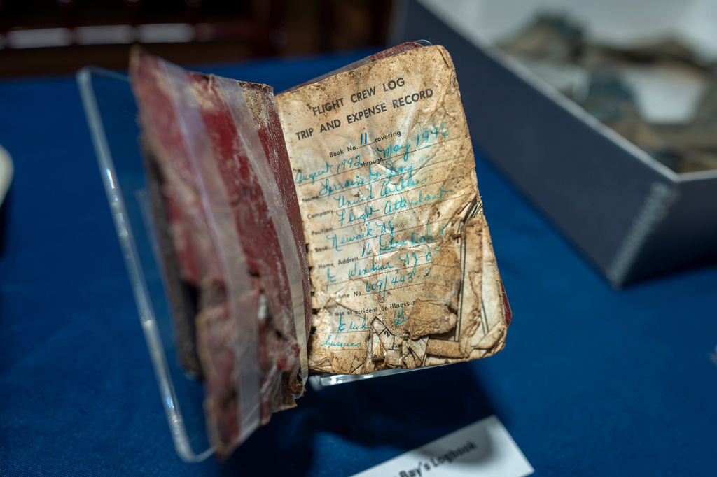 A log book recovered from the wreckage of United Airlines Flight 93 in Shanksville, Pa., is put on temporary display at the Smithsonian's National Museum of American History in Washington, Thursday, Sept. 10, 2026. (AP Photo/J. Scott Applewhite)