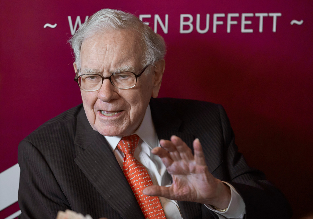 FILE - Warren Buffett, chairman and CEO of Berkshire Hathaway, speaks during a game of bridge following the annual Berkshire Hathaway shareholders meeting May 5, 2019, in Omaha, Neb. (AP Photo/Nati Harnik, File)