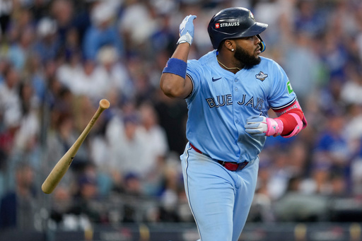 Toronto Blue Jays' Vladimir Guerrero Jr. flips his bat after hitting a two run against the Los Angeles Dodgers during the third inning in Game 4 of baseball's World Series, Tuesday, Oct. 28, 2025, in Los Angeles. (AP Photo/Ashley Landis) Toronto Blue Jays' Vladimir Guerrero Jr. flips his bat after hitting a two run against the Los Angeles Dodgers during the third inning in Game 4 of baseball's World Series, Tuesday, Oct. 28, 2025, in Los Angeles. (AP Photo/Ashley Landis)