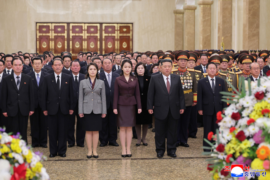 In this photo provided by the North Korean government, leader Kim Jong Un, center right, his wife Ri Sol Ju, third left, and their daughter, center, believed to be named Kim Ju Ae, visit Kumsusan Palace of the Sun in Pyongyang, North Korea, Thursday, Jan. 1, 2026. Independent journalists were not given access to cover the event depicted in this image distributed by the North Korean government. The content of this image is as provided and cannot be independently verified. Korean language watermark on image as provided by source reads: "KCNA" which is the abbreviation for Korean Central News Agency. (Korean Central News Agency/Korea News Service via AP)