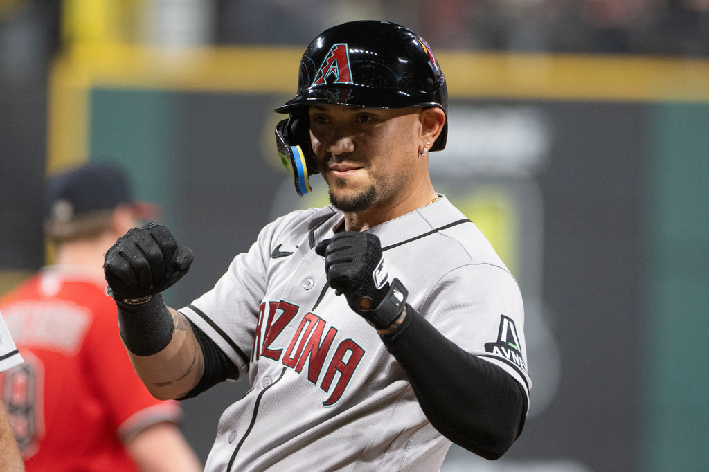 Arizona Diamondbacks' Ildemaro Vargas reacts after hitting an RBI single off Cleveland Guardians relief pitcher Hunter Gaddis during the seventh inning of a baseball game, Saturday, Aug. 1, 2026, in Cleveland. (AP Photo/Phil Long)