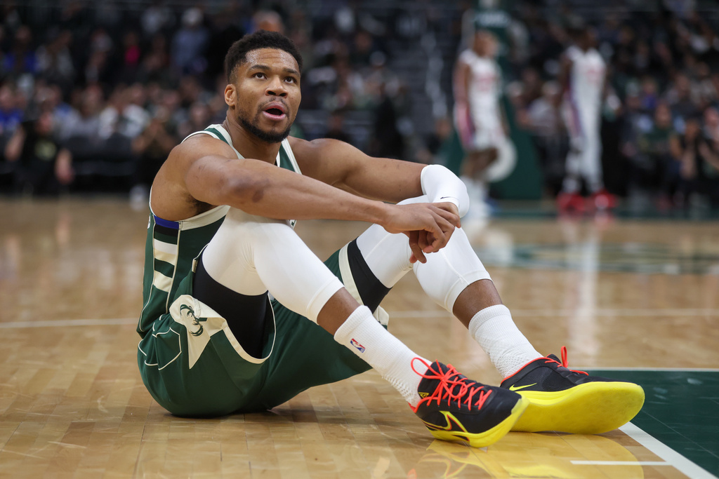 Milwaukee Bucks' Giannis Antetokounmpo reacts after suffering an injury during the first half an NBA basketball game against the Detroit Pistons, Wednesday, Dec. 3, 2025, in Milwaukee. (AP Photo/Kylie Bridenhagen)