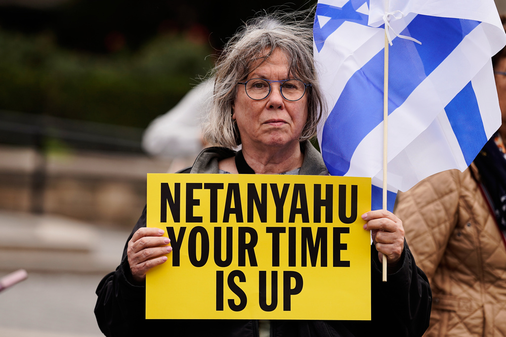 A person holds a sign during a protest ahead of Israeli Prime Minister Benjamin Netanyahu's address at the 81st session of the United Nations General Assembly, Thursday, Sept. 24, 2026, in New York. (AP Photo/Madison Swart)