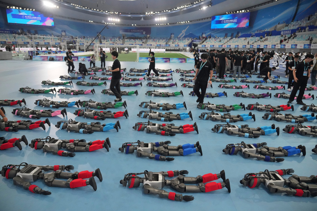 Robots are prepared ahead the opening ceremony of the World Humanoid Robot Games in Beijing, Saturday, Aug. 22, 2026. (AP Photo/Achmad Ibrahim)