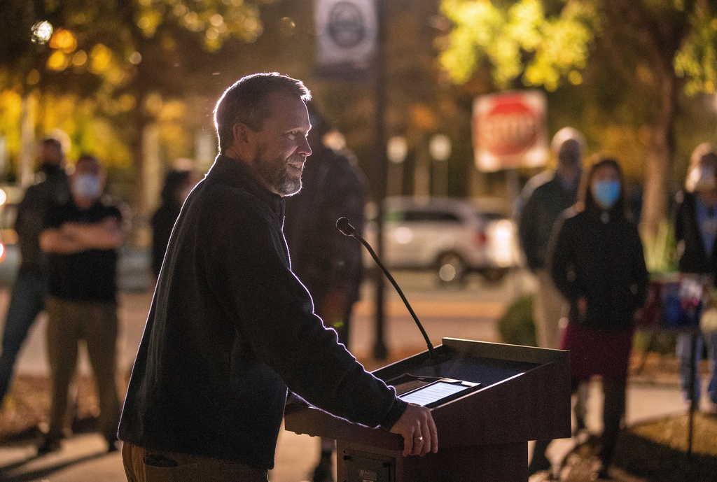 Bishop Steve Wood of St. Andrew's Church thanks health care workers at East Cooper Medical Center, where he was a patient fighting COVID-19 easier in the year, during an evening event to honor health care workers at East Cooper Medical Center Monday, Dec. 14, 2020. (Grace Beahm Alford/The Post And Courier via AP)