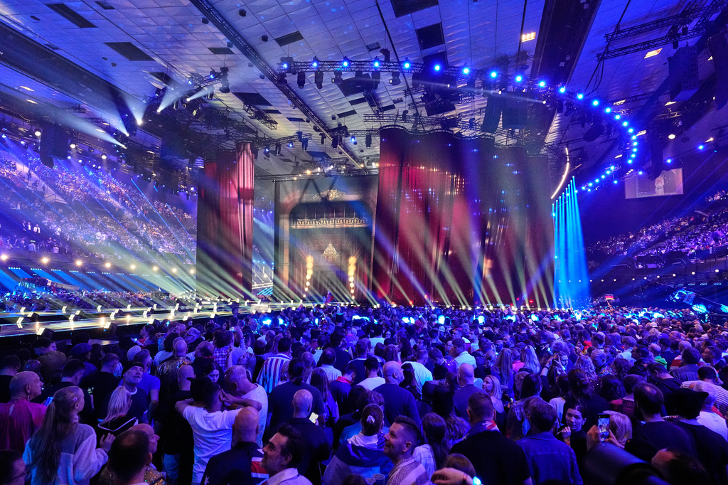 Spectators wait for the start of the Grand Final of the 70th Eurovision Song Contest in Vienna, Austria, Saturday, May 16, 2026. (AP Photo/Martin Meissner)