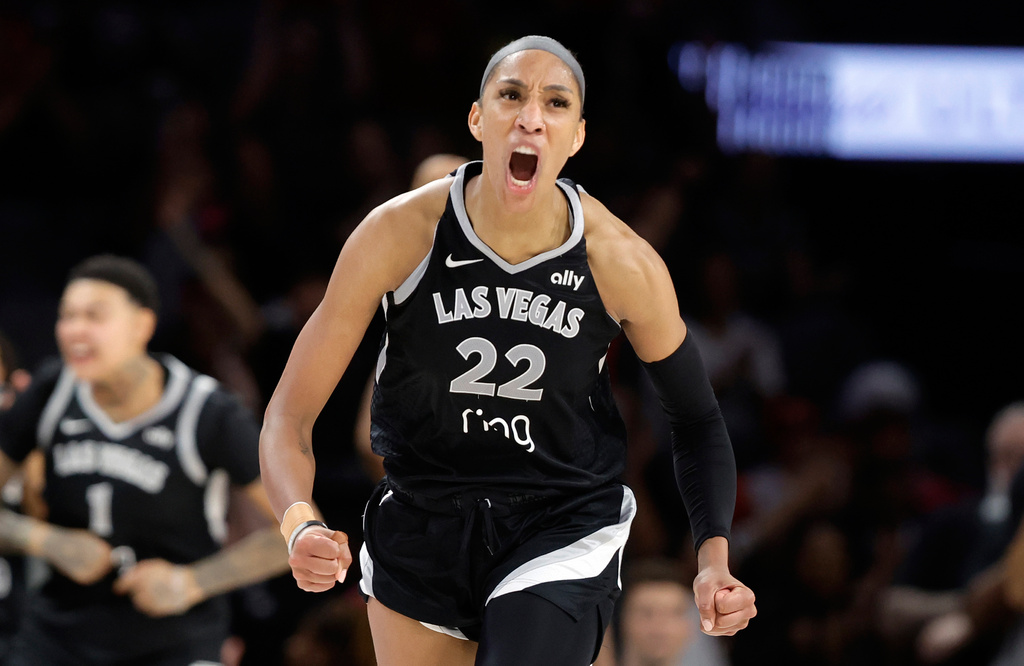 FILE - Las Vegas Aces center A'ja Wilson (22) celebrates after making a basket against the Atlanta Dream during the second half of a WNBA basketball game Tuesday, Aug. 19, 2025, in Las Vegas. (Steve Marcus/Las Vegas Sun via AP, File)