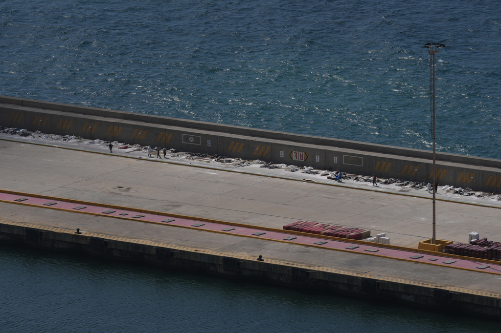 The bodies of earthquake victims lie on a dock at the seaport in La Guaira, Venezuela, Monday, June 29, 2026. (AP Photo/Matias Delacroix)