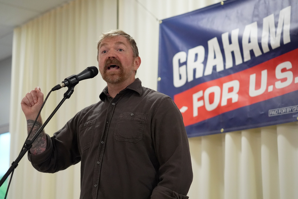 Graham Platner, Democratic candidate for U.S. Senate, speaks to an overflow crowd outside a campaign event Sunday, June 7, 2026, in Portland, Maine. (AP Photo/Robert F. Bukaty)
