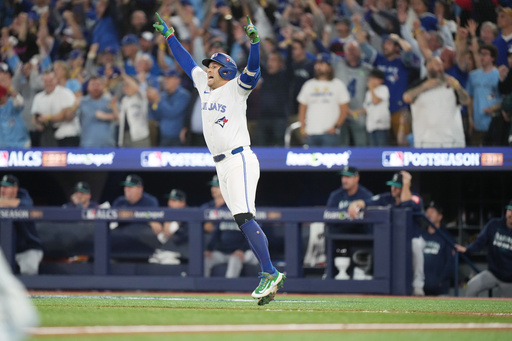 Toronto Blue Jays' George Springer celebrates after hitting a three-run home run against the Seattle Mariners during the seventh inning in Game 7 of baseball's American League Championship Series in Toronto, Monday, Oct. 20, 2025. (Nathan Denette/The Canadian Press via AP) Toronto Blue Jays' George Springer celebrates after hitting a three-run home run against the Seattle Mariners during the seventh inning in Game 7 of baseball's American League Championship Series in Toronto, Monday, Oct. 20, 2025. (Nathan Denette/The Canadian Press via AP)