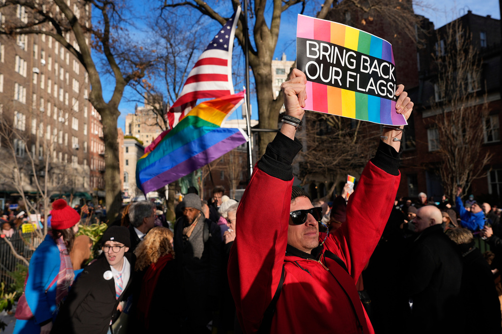 FILE - People demonstrate after New York politicians and activists raised a rainbow flag on a pole across the street from the Stonewall Inn, Thursday, Feb. 12, 2026, in New York, a few days after it was removed by the National Park Service to comply with guidance from the Trump administration. (AP Photo/Yuki Iwamura, File)