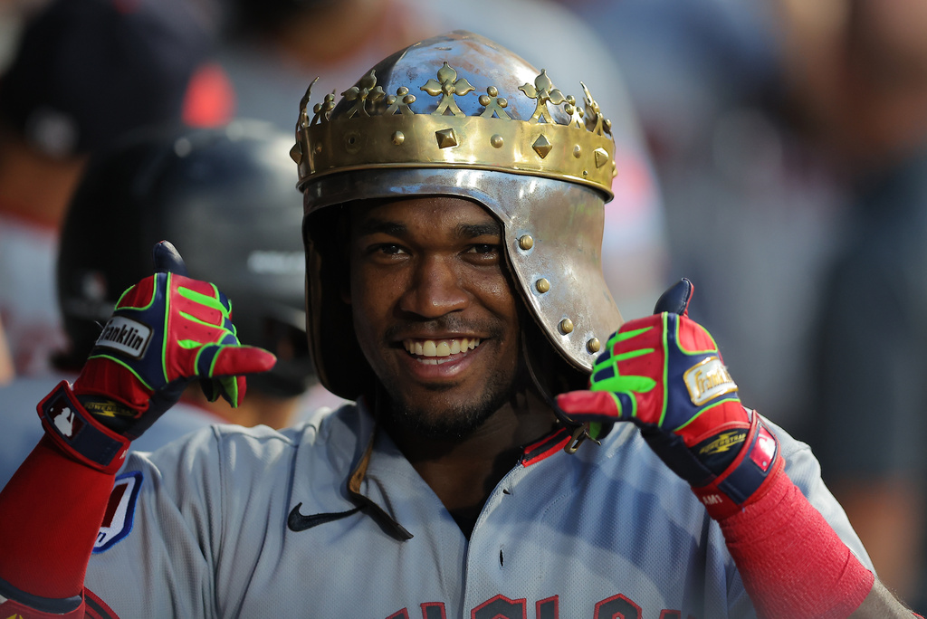 Cleveland Guardians' Angel Martínez celebrates in the dugout after his grand slam during the fifth inning of a baseball game against the Chicago White Sox, Friday, Aug. 7, 2026, in Chicago. (AP Photo/Melissa Tamez)