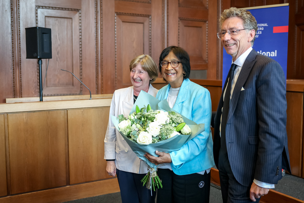 South African-born jurist and former U.N. human rights chief Navanethem "Navi" Pillay, center, poses with the former president of the International Criminal Court (ICC), Silvia Fern&aacute;ndez de Gurmendi, and the director of the International Academy of the Nuremberg Principles, Christoph Safferling, at the Nuremberg Forum in Nuremberg, Germany, Friday, Oct. 9, 2026, following the announcement that she had been awarded the 2026 Nobel Peace Prize. (Daniel Karmann/dpa via AP)