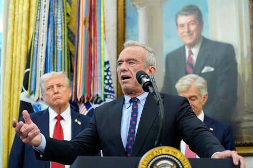 Secretary of Health and Human Services Robert F. Kennedy, Jr., speaks in the Oval Office of the White House, Tuesday, Sept. 30, 2025, in Washington, as President Donald Trump, left, and Mehmet Oz, Administrator for the Centers for Medicare & Medicaid Services, look on. (AP Photo/Alex Brandon) Secretary of Health and Human Services Robert F. Kennedy, Jr., speaks in the Oval Office of the White House, Tuesday, Sept. 30, 2025, in Washington, as President Donald Trump, left, and Mehmet Oz, Administrator for the Centers for Medicare & Medicaid Services, look on. (AP Photo/Alex Brandon)